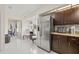 Bright kitchen featuring stainless steel appliances, granite countertops, and modern lighting at 1007 Lake Avoca Dr, Tarpon Springs, FL 34689