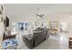 Bright, spacious living room featuring tile floors, vaulted ceiling, and access to the sunroom at 1007 Lake Avoca Dr, Tarpon Springs, FL 34689