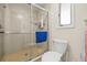 Walk-in shower with glass enclosure, tile surround, and a tiled seat at 1007 Lake Avoca Dr, Tarpon Springs, FL 34689