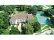 A charming community featuring a tennis court, water features, mature trees, and convenient parking at 102 Brent Cir, Oldsmar, FL 34677