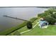 Scenic aerial view showcases the pier, park, and waterfront views, offering a picturesque setting for recreation and relaxation at 102 Brent Cir, Oldsmar, FL 34677