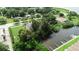 Aerial view featuring homes along the water with private docks and lush greenery at 102 Brent Cir, Oldsmar, FL 34677