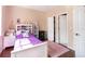 Bright bedroom with hardwood flooring and a white bookshelf display at 102 Brent Cir, Oldsmar, FL 34677