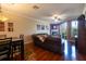 Inviting living room features hardwood floors, fireplace, and sliding doors to balcony at 102 Brent Cir, Oldsmar, FL 34677