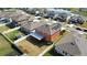 Aerial view of a home with solar panels and a backyard featuring a covered patio at 11804 Bluegrass Field Ct, Riverview, FL 33579