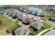 A beautiful neighborhood with homes surrounding a serene lake at 11804 Bluegrass Field Ct, Riverview, FL 33579
