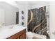 Bathroom featuring a vanity with a white sink and a shower with a decorative curtain at 11804 Bluegrass Field Ct, Riverview, FL 33579