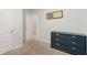 Bedroom featuring neutral walls, carpeted floors, and a dresser at 11804 Bluegrass Field Ct, Riverview, FL 33579