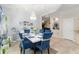 Elegant dining room featuring a modern chandelier, stylish decor, and comfortable seating at 11804 Bluegrass Field Ct, Riverview, FL 33579