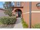 Charming home featuring a beautiful front door framed by an arched entryway and manicured landscaping at 11804 Bluegrass Field Ct, Riverview, FL 33579