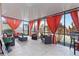 Enclosed patio featuring seating area with orange curtains, offering a relaxing outdoor space at 11804 Bluegrass Field Ct, Riverview, FL 33579