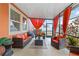 Enclosed patio featuring seating area with orange curtains, offering a relaxing outdoor space at 11804 Bluegrass Field Ct, Riverview, FL 33579