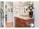 This bathroom offers natural light and granite countertops at 15808 Sea Pines Dr, Hudson, FL 34667