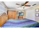 Comfortable bedroom with a ceiling fan and closet at 15808 Sea Pines Dr, Hudson, FL 34667