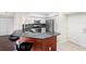 Modern kitchen featuring stainless steel appliances, granite countertops, and dark wood cabinetry at 4516 Seagull Dr # 303, New Port Richey, FL 34652