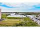 Scenic waterfront view with docks, lush mangroves, and clear blue skies at 4516 Seagull Dr # 303, New Port Richey, FL 34652