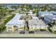 Aerial view of the Royal Orleans property with a well-maintained exterior, landscaping and ample parking at 16333 Gulf Blvd # 105, St Petersburg, FL 33708
