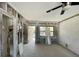 Living room view of a home undergoing renovations with pool outside at 16333 Gulf Blvd # 105, St Petersburg, FL 33708