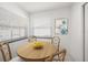 Bright breakfast nook with a round table, wooden chairs, and natural light at 1672 Cambridge Dr, Clearwater, FL 33756