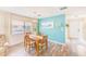 Charming dining room featuring modern decor, an accent wall, and beautiful natural light at 2546 Oakleaf Ln # 35D, Clearwater, FL 33763