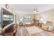 Inviting living room featuring hardwood floors, a ceiling fan, and comfortable seating for relaxing and entertaining at 2546 Oakleaf Ln # 35D, Clearwater, FL 33763