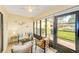 Cozy sunroom featuring tiled floors, ample natural light, and comfortable seating for relaxing and entertaining at 2546 Oakleaf Ln # 35D, Clearwater, FL 33763