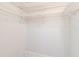 Spacious walk-in closet includes white wire shelves for easy organization of clothing, shoes, and accessories at 2546 Oakleaf Ln # 35D, Clearwater, FL 33763