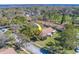 Aerial view of property with mature trees and a street nearby at 2567 Bentley Dr, Palm Harbor, FL 34684