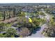 Aerial view of the property showing the proximity to community pool and tennis courts at 2567 Bentley Dr, Palm Harbor, FL 34684