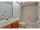 Bright bathroom featuring a shower and tub combination and a skylight at 2567 Bentley Dr, Palm Harbor, FL 34684