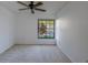 Bright bedroom with a large window overlooking the neighborhood at 2567 Bentley Dr, Palm Harbor, FL 34684