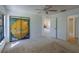 Bright bedroom with unique stained glass sliding door and neutral carpeting at 2567 Bentley Dr, Palm Harbor, FL 34684