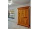 This bedroom features carpet, a wardrobe, and a view of the outside at 2567 Bentley Dr, Palm Harbor, FL 34684