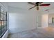 This bedroom features carpet and natural light from the windows at 2567 Bentley Dr, Palm Harbor, FL 34684