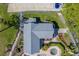 A close aerial view of the roof, spa, and other community features at 2567 Bentley Dr, Palm Harbor, FL 34684