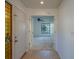 Inviting entryway leading into a bright living space with double doors at 2567 Bentley Dr, Palm Harbor, FL 34684