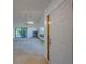 Bright living room features a fireplace and sliding doors to the lanai at 2567 Bentley Dr, Palm Harbor, FL 34684