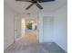 Neutral living room with double doors leading into another room and closet space at 2567 Bentley Dr, Palm Harbor, FL 34684