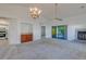 Spacious living room with vaulted ceiling, fireplace, and wet bar at 2567 Bentley Dr, Palm Harbor, FL 34684
