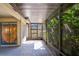 Screened-in patio with stained glass and great light at 2567 Bentley Dr, Palm Harbor, FL 34684