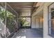 Screened-in patio with shade trees at 2567 Bentley Dr, Palm Harbor, FL 34684