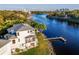 Aerial shot of the home on the river featuring a private dock and nearby city skyline at 2902 N Shoreview Pl, Tampa, FL 33602