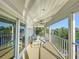 Waterfront balcony featuring seating, ceiling fan, and beautiful water view at 2902 N Shoreview Pl, Tampa, FL 33602