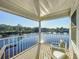 Inviting balcony offering a serene view of the waterfront, complete with comfortable seating for relaxation at 2902 N Shoreview Pl, Tampa, FL 33602