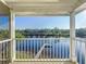 Balcony view overlooking the river and private dock surrounded by trees at 2902 N Shoreview Pl, Tampa, FL 33602