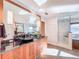 Bathroom featuring dual vanity, marble counters, and a glass-enclosed shower at 2902 N Shoreview Pl, Tampa, FL 33602