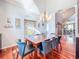 Bright dining room with hardwood floors, custom lighting, and large window at 2902 N Shoreview Pl, Tampa, FL 33602