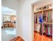 Hallway view looking into the bathroom and walk-in closet with custom shelving at 2902 N Shoreview Pl, Tampa, FL 33602