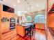 Contemporary kitchen with island, stainless appliances, and sun-filled windows at 2902 N Shoreview Pl, Tampa, FL 33602