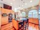 Bright kitchen with custom cabinets, oversized island with seating, stainless appliances, and hardwood floors at 2902 N Shoreview Pl, Tampa, FL 33602